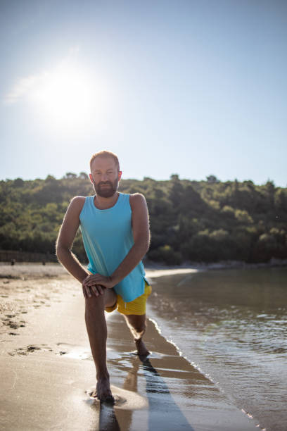 istock Morning exercise on the beach by the sea 1357106639