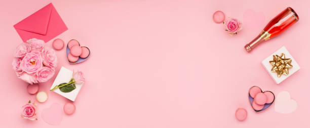 istock Flowers roses, gift box and sweets macaroons on pink background. Valentines day concept. Flat lay, top view, copy space. 1357106703
