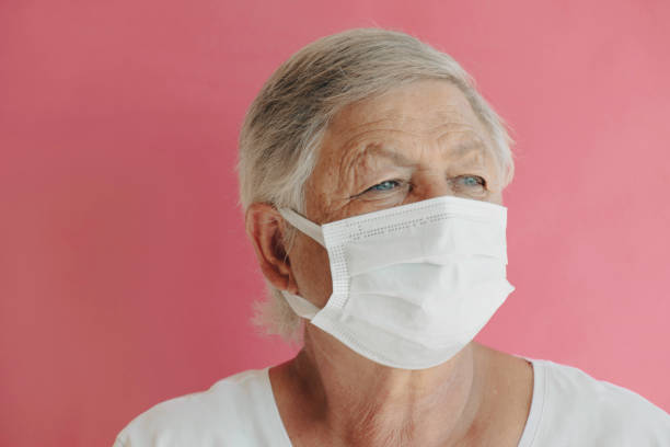 istock Senior Woman With Face Mask 1357107915