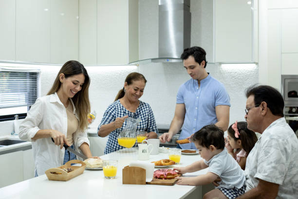 istock Family eating and drinking on breakfast at home 1357108728