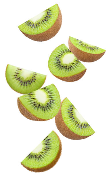 istock Flying kiwi slices on white 1357110897