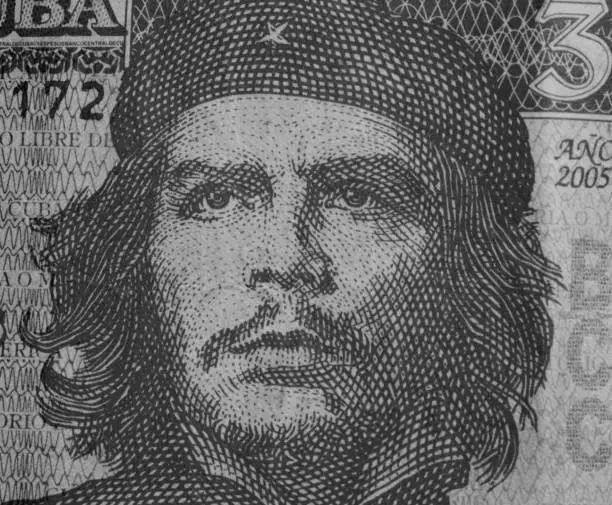 Ernesto Che Guevara on 3 Pesos 2005 Banknote from Cuba over Cuba map on globe