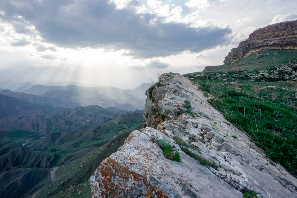 istock Sheer cliff of the mountain range at sunset 1357111804