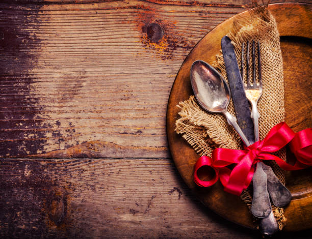 istock Vintage silverware decorated with red ribbon for valentines day dinner celebration 1357112910