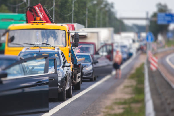 istock Massive traffic jam congestion on a multiple lane highway, road closure during road repair works maintenance, drivers outside their cars and trucks, road temporary closed 1357116078