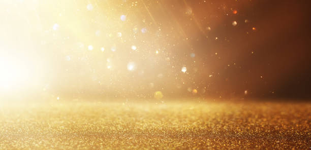 istock background of abstract gold and silver glitter lights. defocused 1357117278