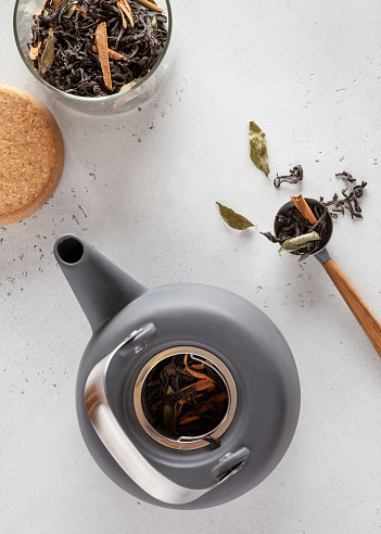 Dried leaves of black tea with cinnamon and bay leaves