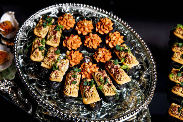 istock Banquet Meat Bar. Cold snacks with vegetables, fish and rucola on bread, canapes 1357126477
