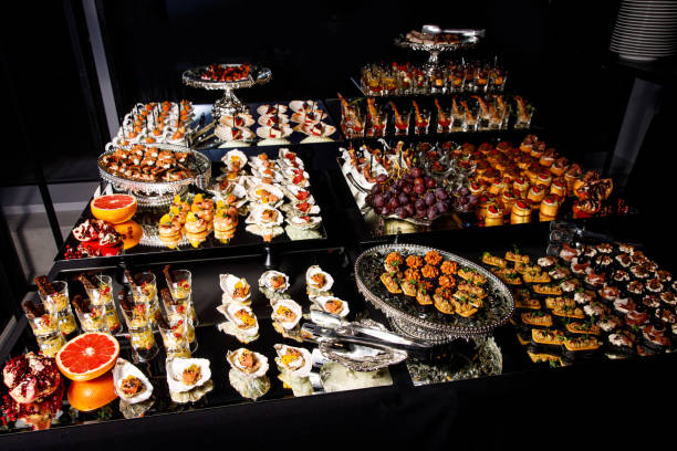 istock Banquet Meat Bar. Cold snacks with vegetables, fish and rucola on bread, canapes 1357126484