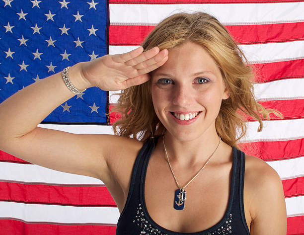 istock Woman saluting with Flag 135712925
