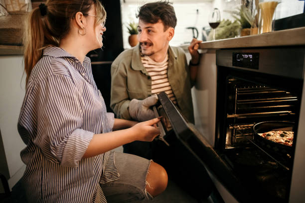 istock Young couple having a glass of wine 1357129295