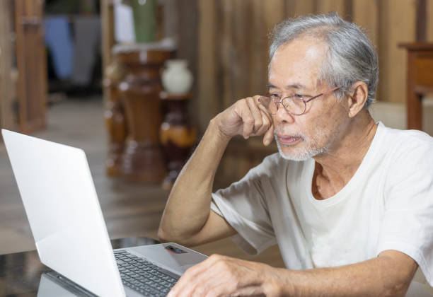 istock seniors working at home on laptops 1357129470