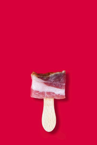 istock Creative photos of bacon on a red background 1357132961