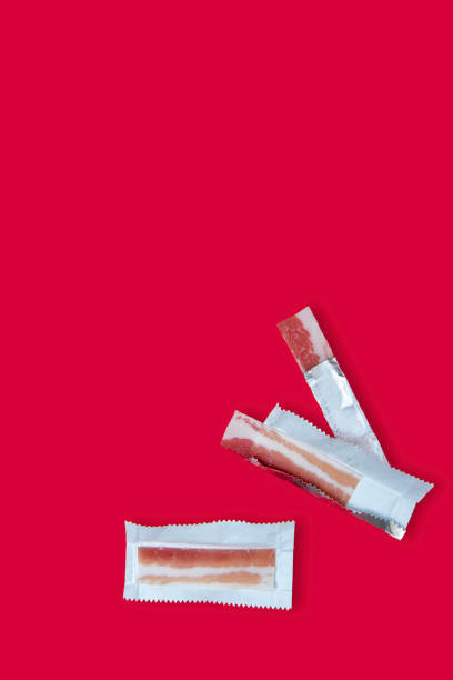 istock Creative photos of bacon on a red background 1357133574