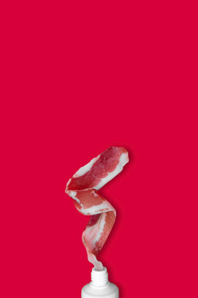Creative photos of bacon on a red background