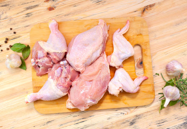 istock Fresh homemade chicken cut into pieces. Chicken carcass 1357140694