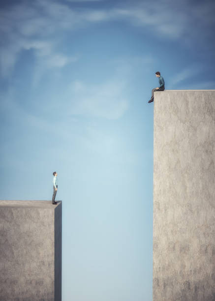istock Gap between two men standing at a different height. Aspirations and risk taking concept. 1357145593