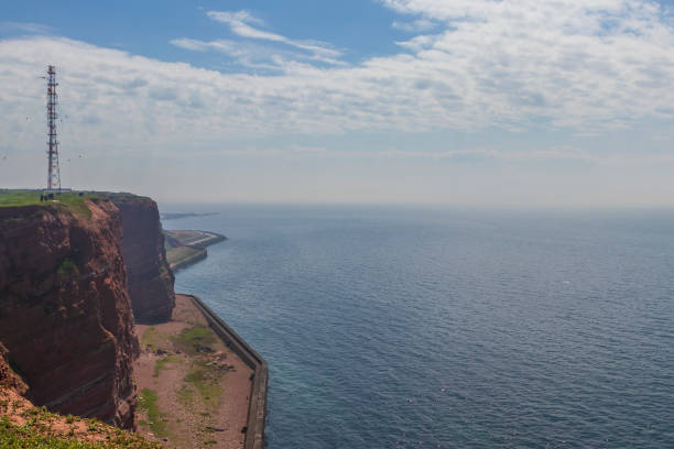 istock Long Anna Anna on Helgoland with blue sky and white clouds. 1357146610