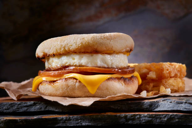 Classic Ham and Egg Breakfast Sandwich Classic Ham and Egg Breakfast Sandwich with Cheese on a Toasted English Muffin with Hash Brown Patties breakfast sandwhich stock pictures, royalty-free photos & images