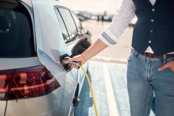Electric car charging.Loading energy of an electric car