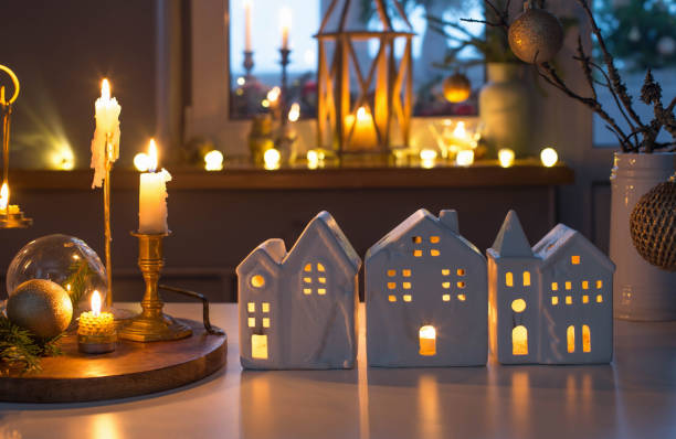istock christmas toy houses with burning candles on  table 1357157272