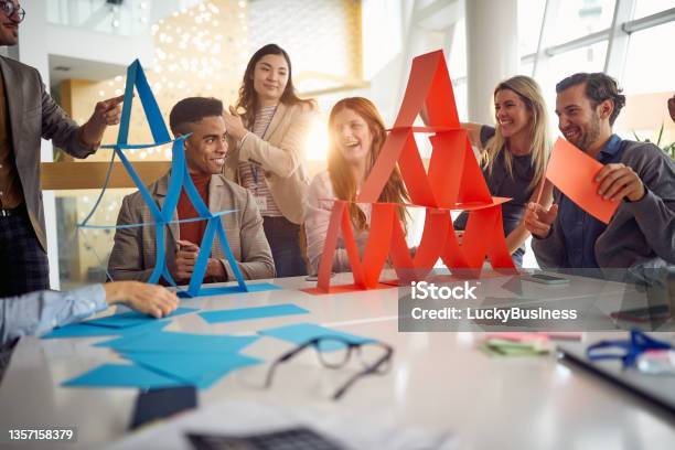 A Group Of Young Business People Is Enjoying Team Building Games During A Break At Work Business People Company Stock Photo - Download Image Now