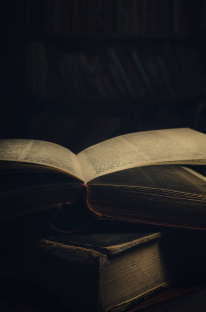 istock Antique book in the dark 1357158648