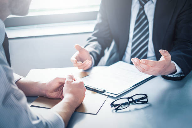 istock Business people negotiating a contract. 1357158735