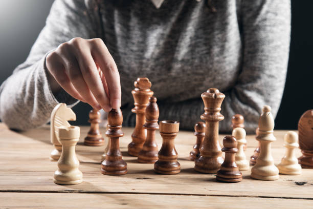 istock The woman is playing chess 1357159412
