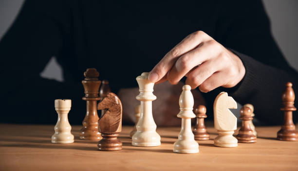 istock Business concept, the man playing chess 1357159474