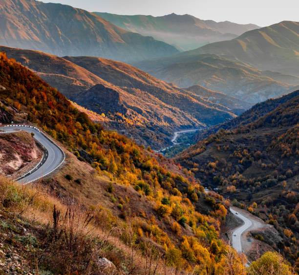 istock mountain with road at the sunset 1357159551