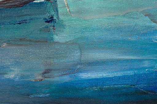 Blue paint on artist canvas