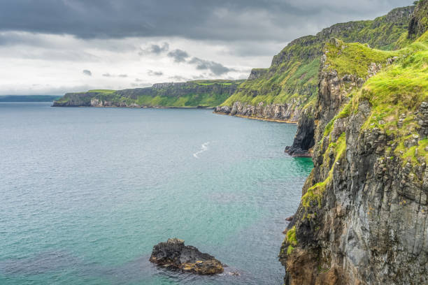 istock Coastline with tall limestone cliffs and turquoise Atlantic Ocean, near Carrick a Rede rope bridge 1357164909