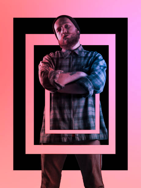 istock Man in polka-dot shirt with beret on his head looking at camera with arms folded. Image with album cover design 1357164924