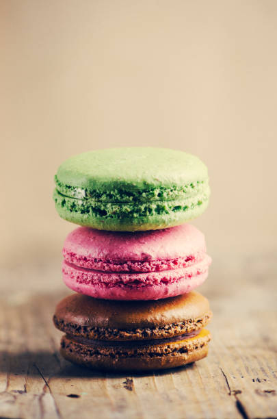 istock Colorful macaroons on wooden table 1357165091
