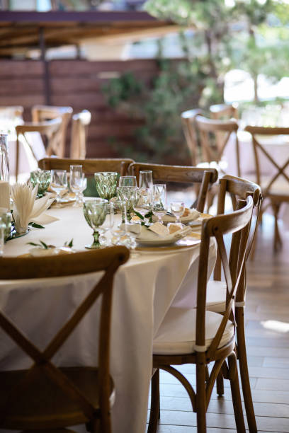 istock White table with tableware and chairs made of wood 1357165294