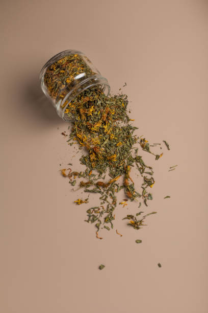istock Dried St. John's wort in a glass jar on a beige background 1357168231