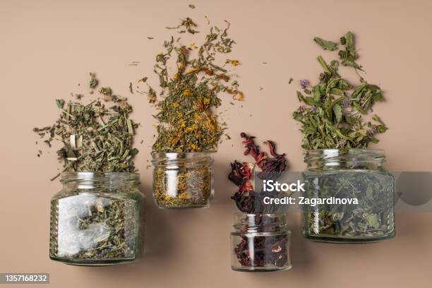 Four Tins Of Healthy Dried Herbs Stock Photo - Download Image Now - Dried Tea Leaves, Tea - Hot Drink, Ayurveda