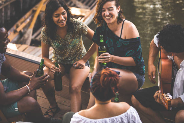 istock Having fun on a picnic by the river 1357169771