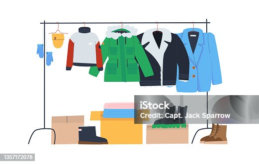 istock Rack with winter clothes on hangers. Boxes and winter shoes. Clothing store or donation. 1357172078