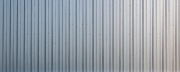 istock Texture of a corrugated sheet metal aluminum facade. 1357174853