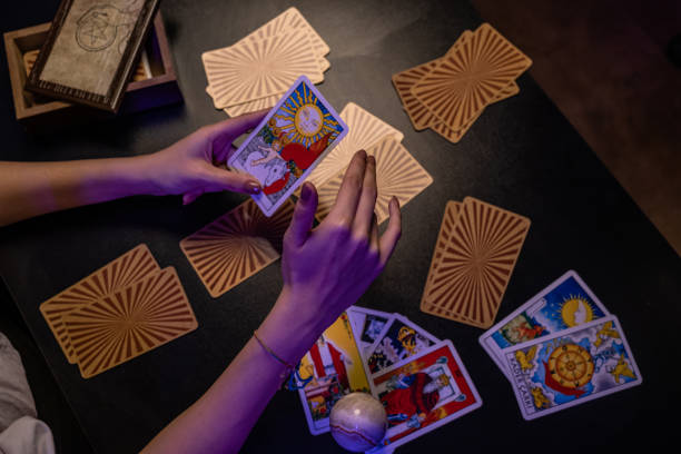 istock fortune teller woman holding tarot cards 1357175792