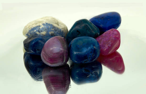 istock Seven purple and blue stones with reflections 1357177018