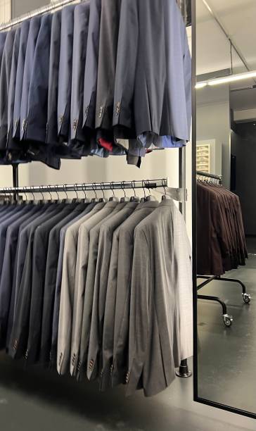 istock Suits on shelfs in department store 1357180820