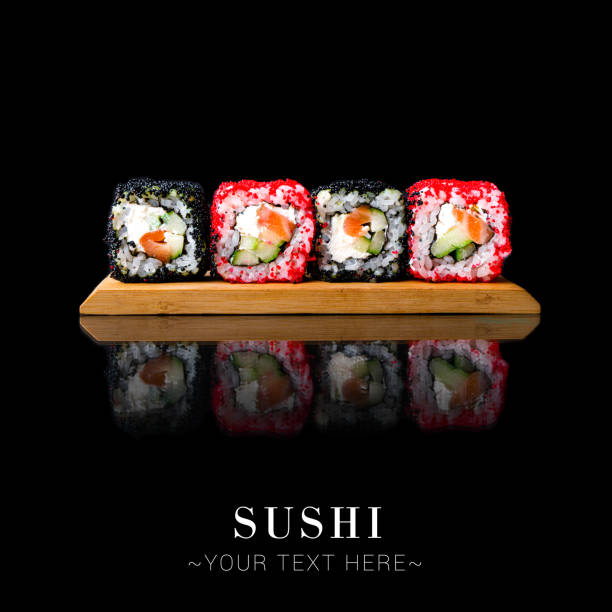 istock Salmon sushi roll with reflection isolated on black background ready food banner with text space 1357181038