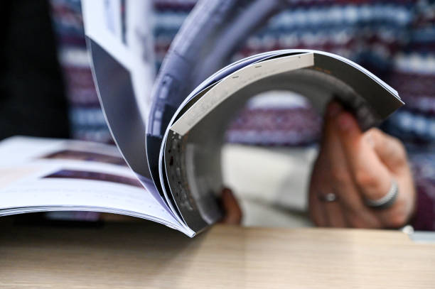 Flip through a magazine stock photo