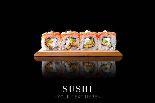 Salmon sushi roll with reflection isolated on black background ready food banner with text space