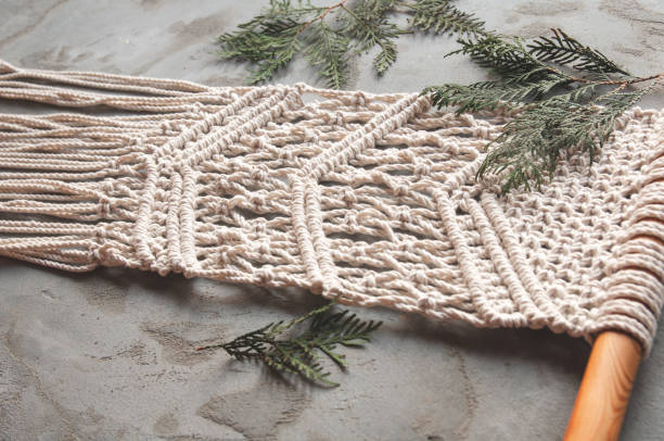 istock Close-up hand made macrame texture pattern. Natural decoration concept in the interior. 1357193872