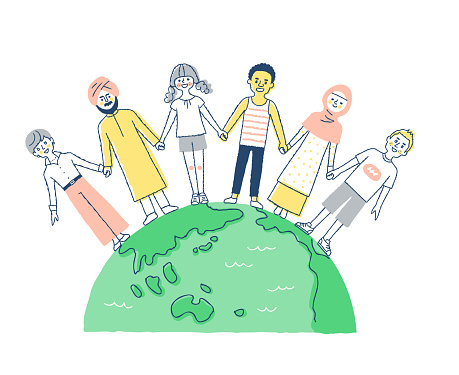 People of various races holding hands with the earth