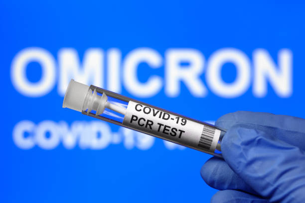 istock Omicron COVID-19 variant and coronavirus PCR test kit, focus on test tube 1357196551